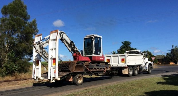 Truck and excavator going to work