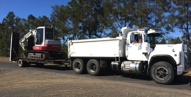 Truck and excavator going to work